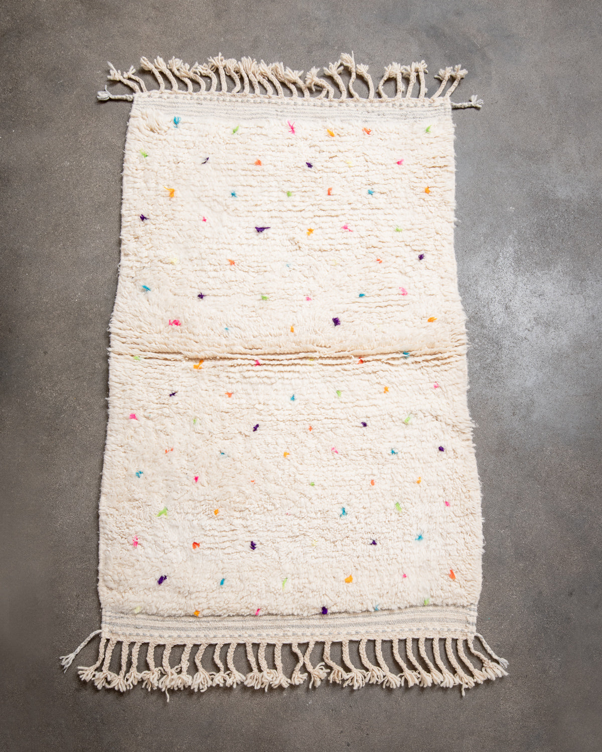 Modern, designer, handcrafted Berber rug from Morocco. Beniourain carpet with beautiful colours and patterns and fluffy wool texture.